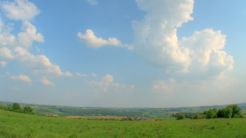 Storm clouds forming over hills, HD time lapse clip, high dynamic range imaging
