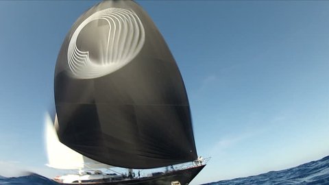 PORTO CERVO, ITALY – AUGUST 30: luxury sailing yacht navigating seen from a camera placed on the water level during Perini Navi Cup on August 30, 2013 in Porto Cervo, Italy
