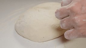 Dough manually bake close-up 4K 2160p UHD footage - Bakery work with dough and flour 4K 3840X2160 UHD video