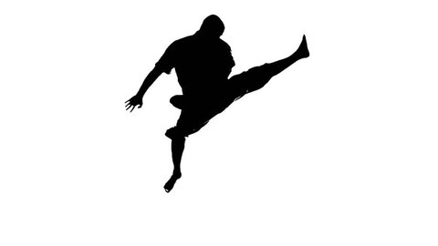 A silhouette of a karate man exercising against white background. Slow motion