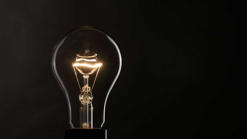 Light Bulb Over Black Background Stock Footage Video 100 Royalty