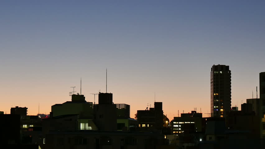 Motion timelapse of multiple colors decorating the autumn sky during twilight.