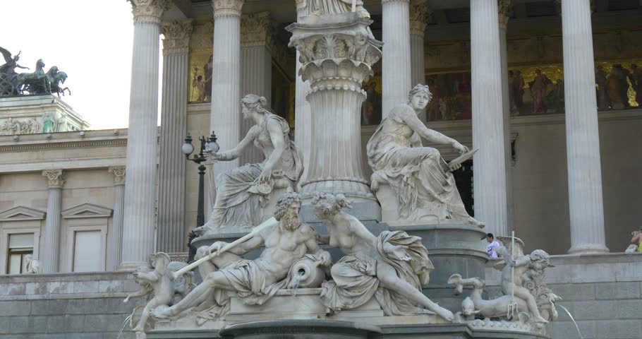 VIENNA, AUSTRIA. The Austrian Parliament and statue of Athena Pallada. Parliament building covers near 13500 square meters.
