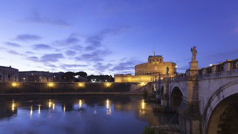 4K Time lapse zoom out Castel Sant Angelo and the Sant Angelo bridge in Rome from twilight illuminated by night. Also known as the Mausoleum of Hadrian.