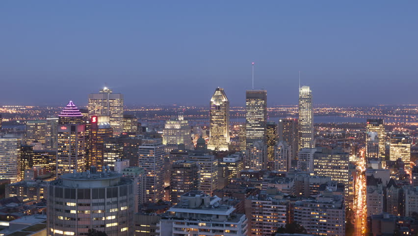MONTREAL, CANADA - OCT 2, 2014: 4K Time lapse zoom out Montreal twilight after sunset viewed from Mont Royal with city skyline