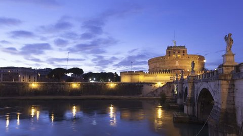 4K Time lapse close up Castel Sant Angelo and the Sant Angelo bridge in Rome from twilight illuminated by night. Also known as the Mausoleum of Hadrian.