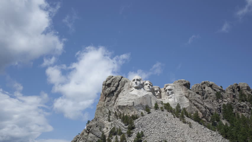 4K Time lapse zoom in at Mt. Rushmore National Memorial Park in South Dakota Sculptures of former U.S. presidents: George Washington, Thomas Jefferson, Theodore Roosevelt and Abraham Lincoln.