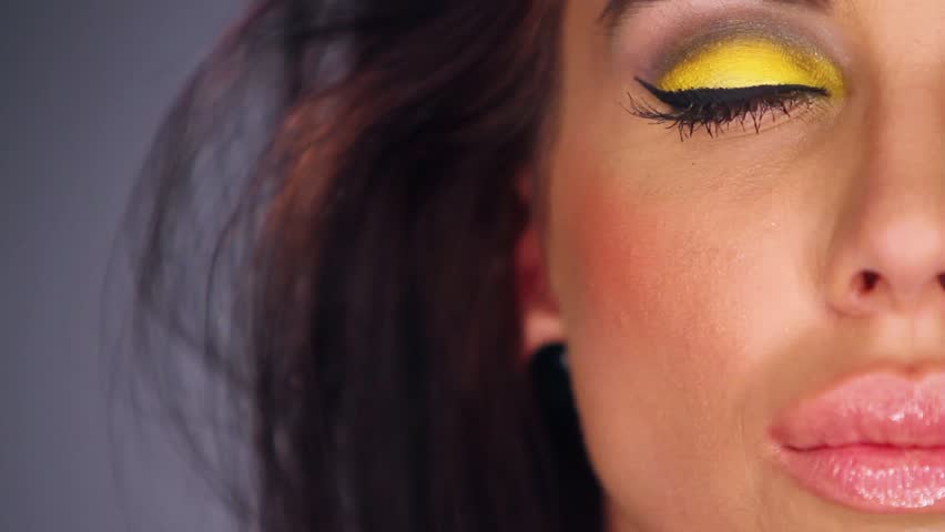Sexy brunette in outstanding yellow makeup