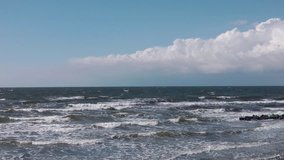 At the Ocean - water waves with blues sky and clouds - Video