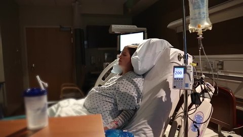 A woman in labor and delivery at the hospital during labor while having contractions