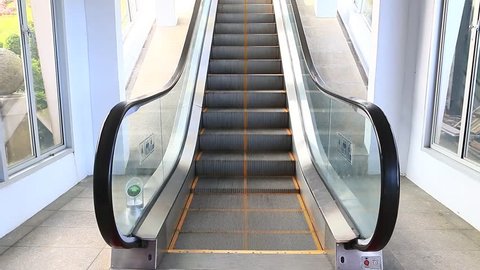 escalators are shown that constantly run upstairs