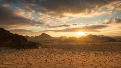 time lapse of Dunes bathed in sunset sunlight in Wadi Rum desert, Jordan, Middle East, Asia - establishing time-lapse 4K video footage
