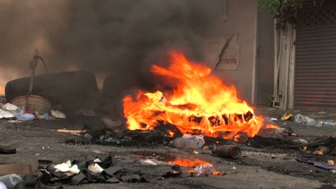 A tire burns during a riot, Bangkok, Thailand - 2010