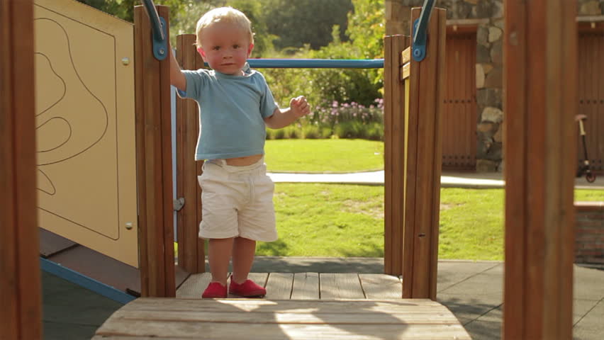 Slow-Motion Of Toddler Playing On Play Structure.