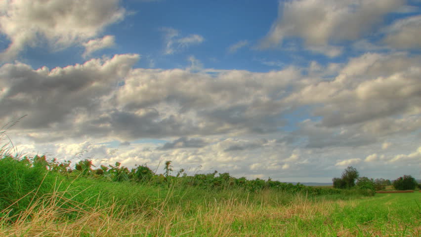 Clouds over fields, motorized camera, HD time lapse clip, high dynamic range