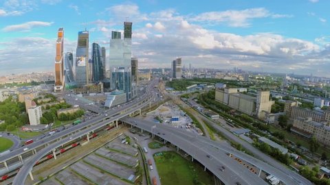Cityscape with skyscrapers complex of Moscow Business Center and traffic on flyover at summer day. Aerial view