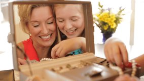 Grandmother And Granddaughter Playing With Jewelry Together Indoors. - Powered by Shutterstock - Get 15% off with code: PIKWIZARD15