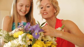 Dolly Shot Of Grandmother And Granddaughter Flower Arranging Together Indoors. - Powered by Shutterstock - Get 15% off with code: PIKWIZARD15
