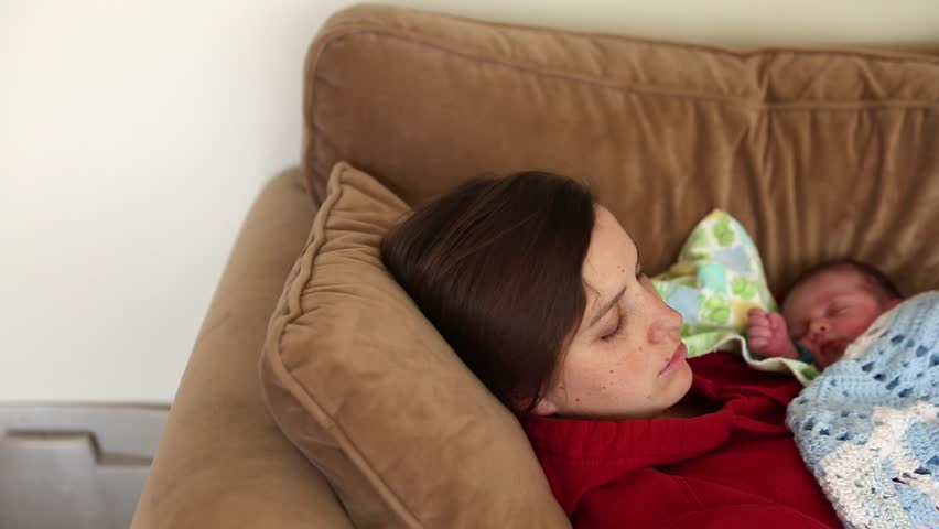 sleeping with baby on chest on couch