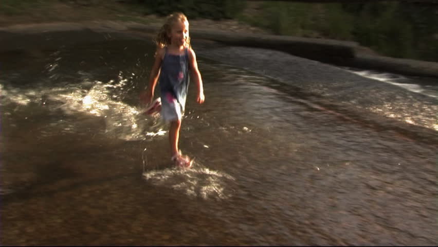 Family In Park, Girl Crossing Stream
