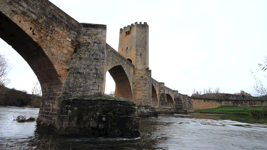 Ancient medieval bridge on a rainy day in Frias, Burgos, Spain