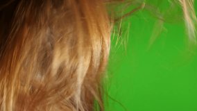 Blond woman hair drying in front of green screen slow motion FullHD 1080p video - Using hair dryer in front of chroma green screen 1920X1080 HD footage