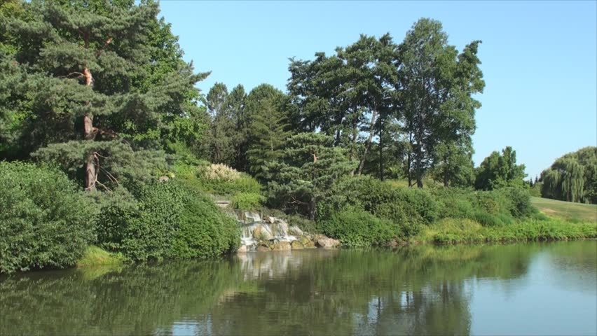 Artificial waterfall pours into lake in Chicago Botanic Garden 2.