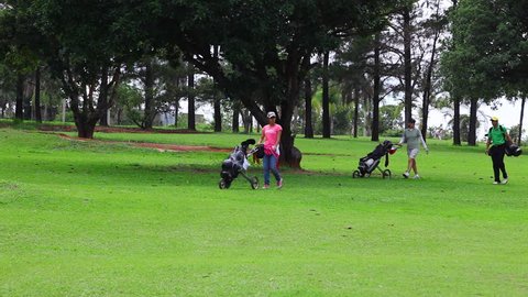 SAO PAULO, BRAZIL: BAURU GOLF CLUB - NOV 2014 - Golfer Carries His Clubs
