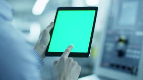 Worker is Using Tablet PC with Green Screen in Portrait Mode in Factory. Great For Mock-Up Usage.
Shot on RED Cinema Camera in 4K.
ProRes codec - Great for editing, color correction and grading.