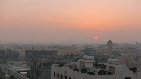 Middle East city view (Timelapse), Sun Rising through clouds, Haze passing Mosque (City of Dammam, Saudi Arabia)