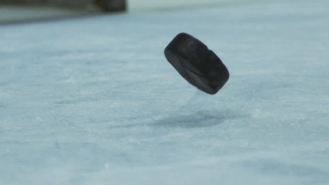 Slow Motion Hockey - Shot on Net Puck Scores Goal