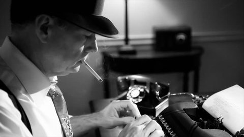 A reporter in a fedora typing on a manual typewriter. Vintage 40's film noir look.