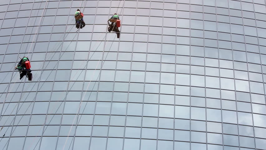 window cleaners at work on skyscraper