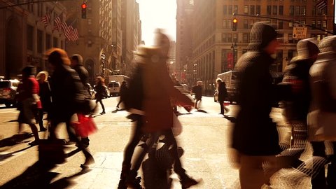 people walking over crosswalk in new york city. pedestrians background