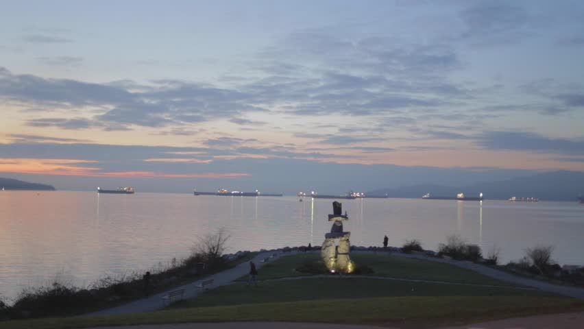 VANCOUVER,CANADA - CIRCA December 2014 :Christmas sunset - English Bay Inukshuk