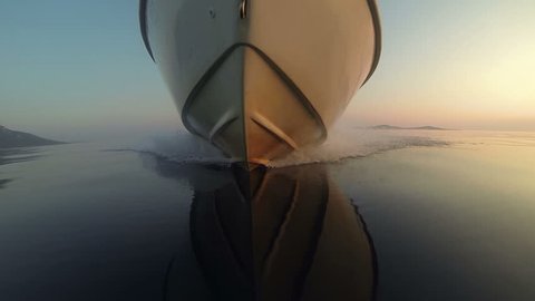 GoPro - View of a speedboat front while gliding on water at sunset