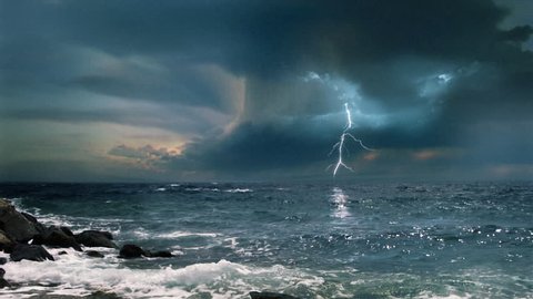 Cinematic storm clouds with lightning strikes reflecting in ocean.