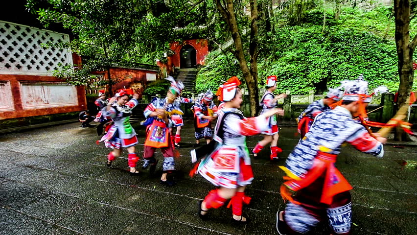 Guizhou,China-Jun 30,2014:Ge people blow Chinese wind pipe and dance for show.