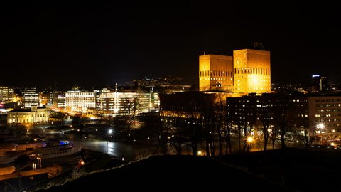 OSLO CITY NORWAY - CA DECEMBER 2014: Night time lapse view of downtown part of Oslo in the middle the City Hall of Oslo