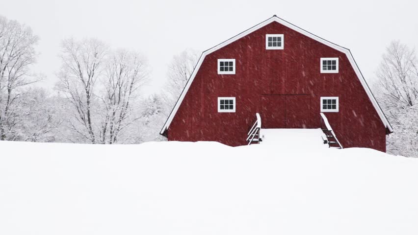 ETNA, NEW HAMPSHIRE December 16th: Snow falling on a classic New England farm and red barn in Etna, New Hampshire on December 16th, 2014 in Etna, New Hampshire. 