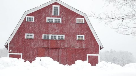 ETNA, NEW HAMPSHIRE December 16th: Snow falling on a classic New England farm and red barn in Etna, New Hampshire on December 16th, 2014 in Etna, New Hampshire. 