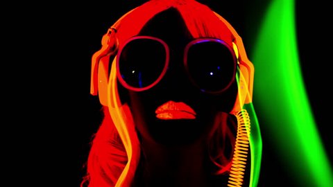 4k fantastic video of sexy cyber raver dancer babe filmed in fluorescent clothing under UV black light
