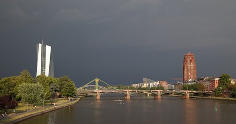 Main River Bridge Frankfurt Skyline Skyscrapers Establishing Shot Thunderstorm ( Ultra High Definition, UltraHD, Ultra HD, UHD, 4K, 2160P, 4096x2160 )
