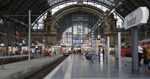 FRANKFURT, GERMANY - JULY 8, 2014 Frankfurt Central Main Station Hauptbahnhof Trains Platform Passengers Wait People Walk ( Ultra High Definition, UltraHD, Ultra HD, UHD, 4K, 2160P, 4096x2160 )