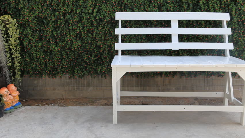 White chair in the garden, empty, no one, nobody, feel lonely scene, lonesome, exiting scary, silence, dolly from right to left