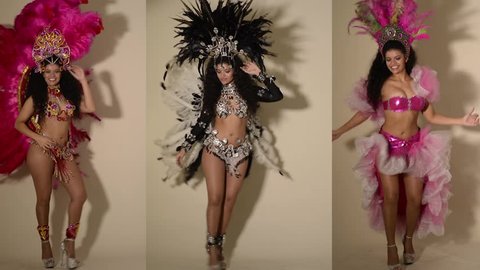 Three beautiful samba dancers wearing typical costumes