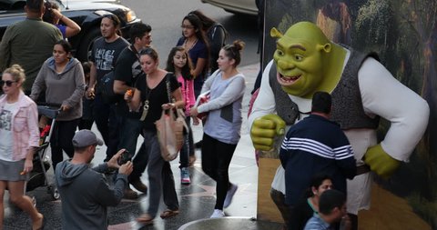 LOS ANGELES, USA - JUNE 18, 2013 People Children Take Photos Shrek Statue Hollywood Boulevard Walk of Fame Photography Establishing Shot ( Ultra High Definition, Ultra HD, UHD, 4K, 2160P, 4096x2160 )