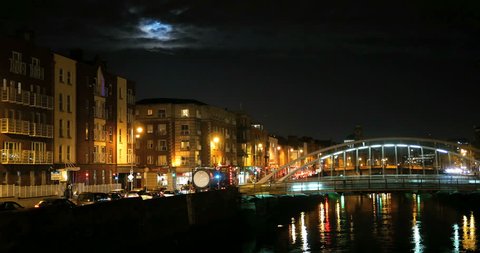 Night view of famous Ha'Penny Bridge in Dublin, Ireland