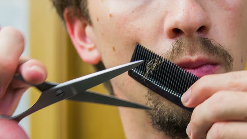 trimming mustache with clippers