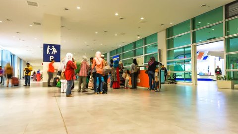 KUALA-LUMPUR - DECEMBER 11: Timelapse of people walking in airport on December 11, 2014 in Kuala-Lumpur, Malaysia. Kuala Lumpur International Airport is Malaysia's main international airport